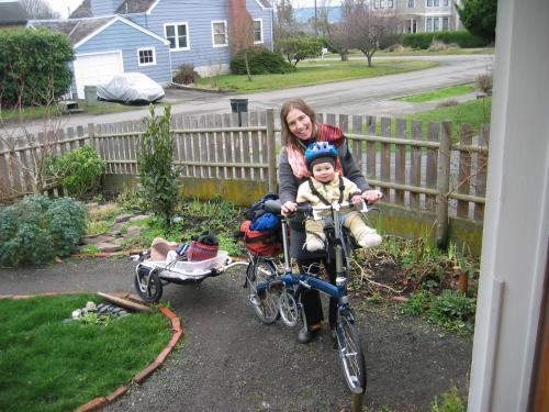adorable lil bu + his mama show the zest of life as they early on ride bicycle with cart behind as they do their chores.